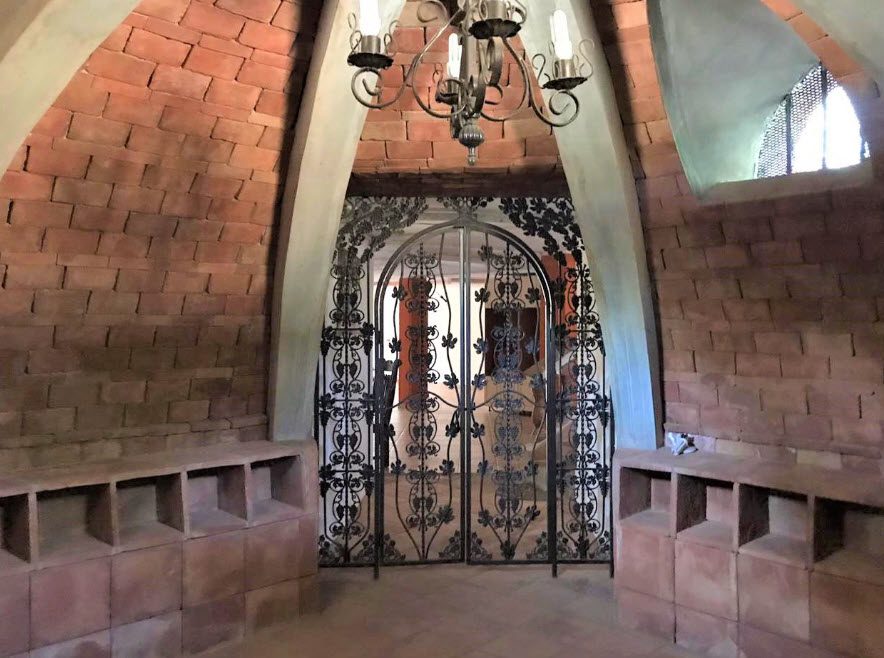 buyDRproperty Interior of a beautiful 5-bedroom villa with arched brick walls and decorative gate. Sosua Real Estate