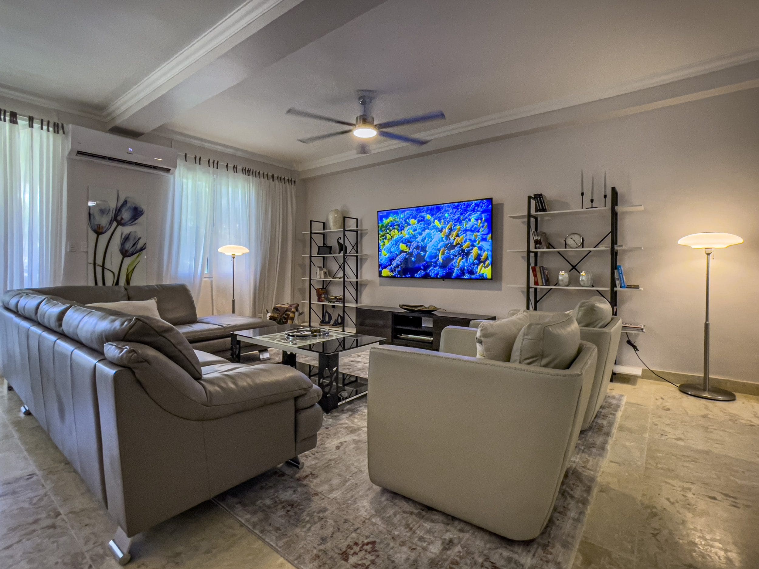 buyDRproperty Living room of a 3 bedroom oceanfront condo, featuring modern furniture and decor. Sosua Real Estate