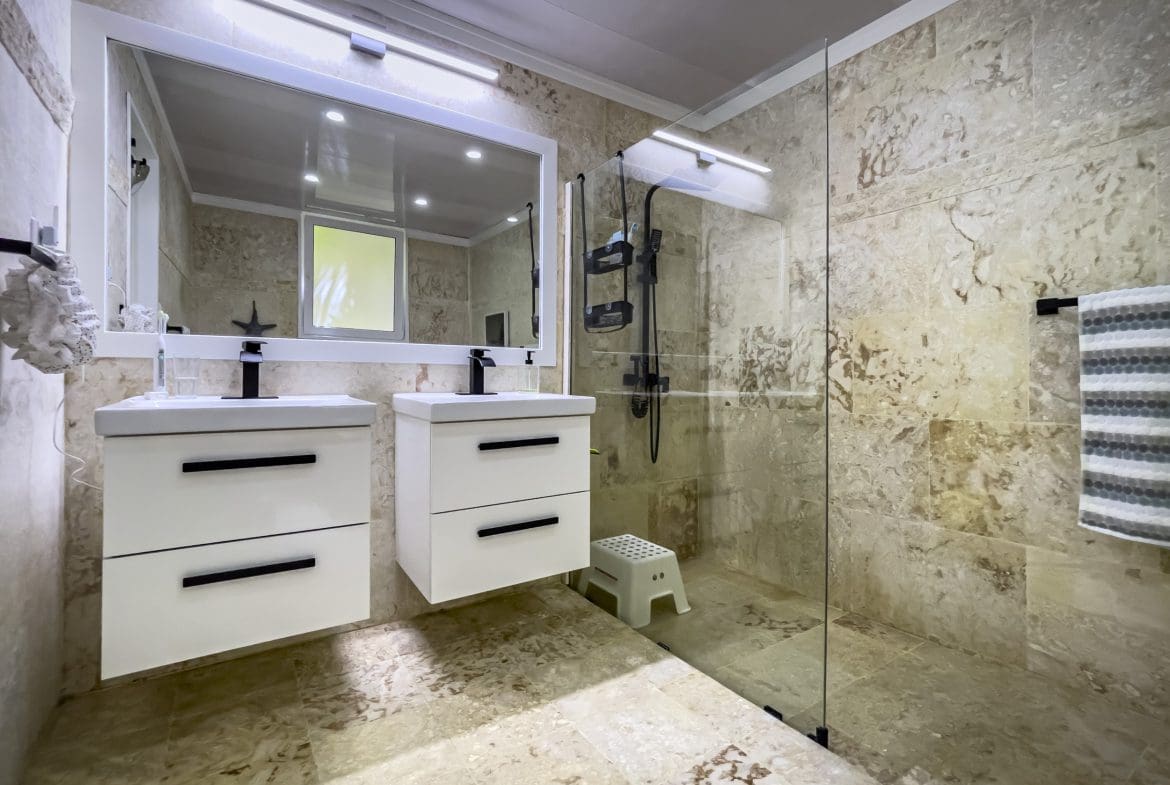 buyDRproperty Modern bathroom with a glass shower and a 3 Bedroom Oceanfront Condo Sosua Real Estate