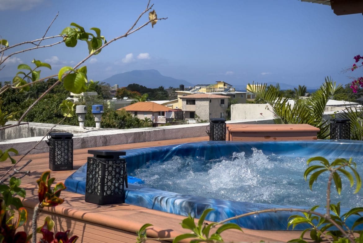 buyDRproperty Rooftop jacuzzi with a view of Sosua. 2 Bedroom Condo in the heart of Sosua. Sosua Real Estate