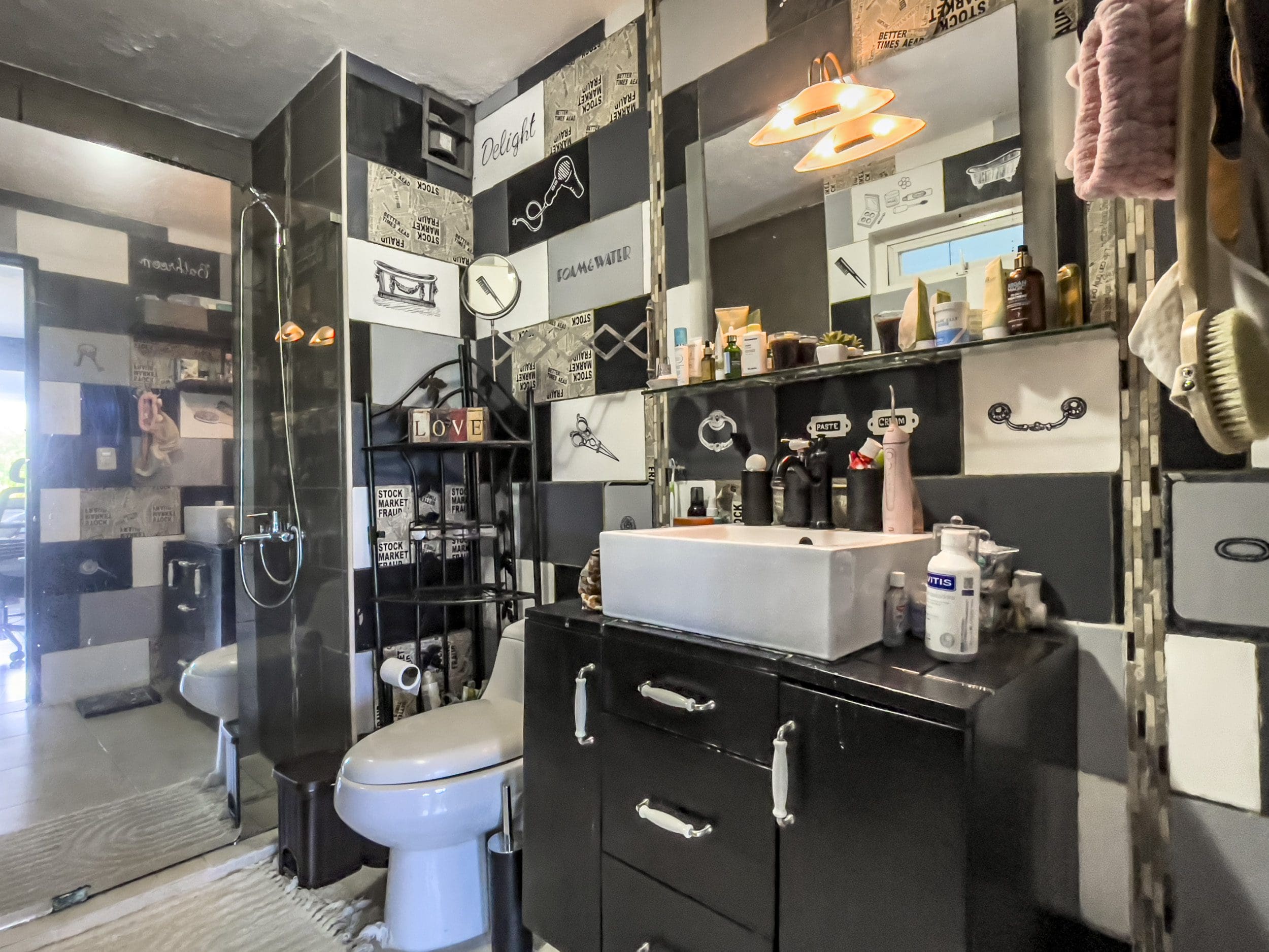buyDRproperty Black and white bathroom with sink and toilet. 2 Bedroom Condo in the heart of Sosua. Sosua Real Estate