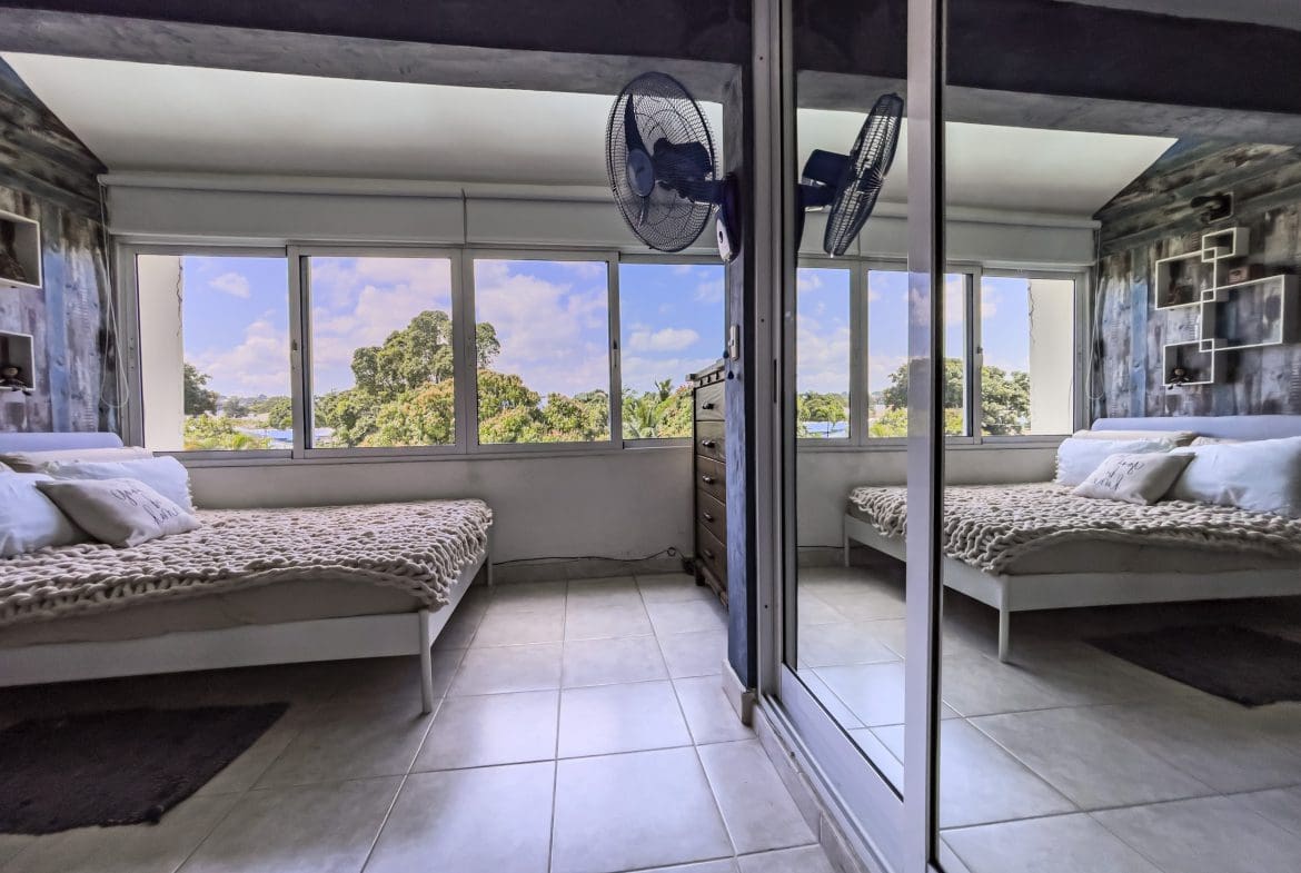 buyDRproperty Cozy bedroom in a 2 Bedroom Condo in Sosua with a view of the outdoors. Sosua Real Estate