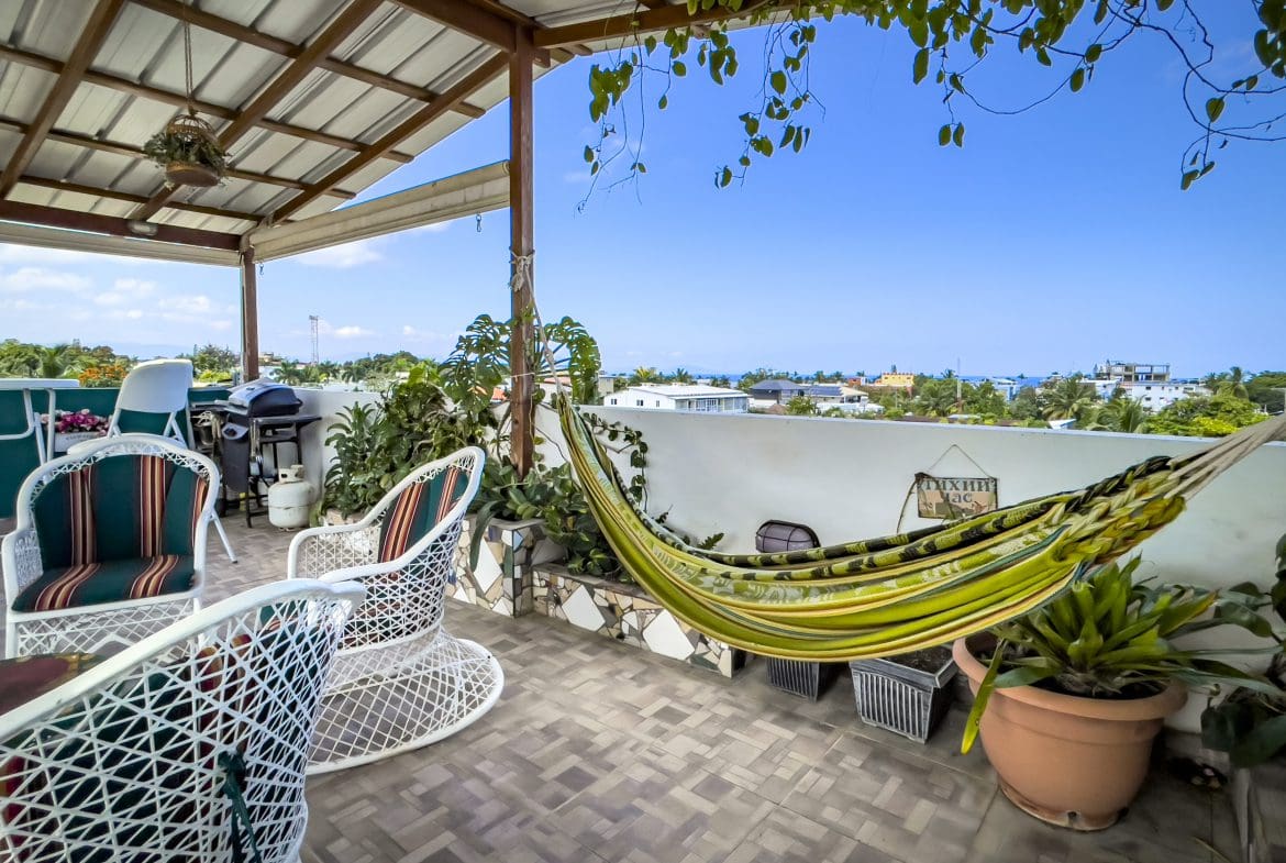 buyDRproperty Rooftop patio of a 2 bedroom condo in Sosua with hammock and chairs. Sosua Real Estate