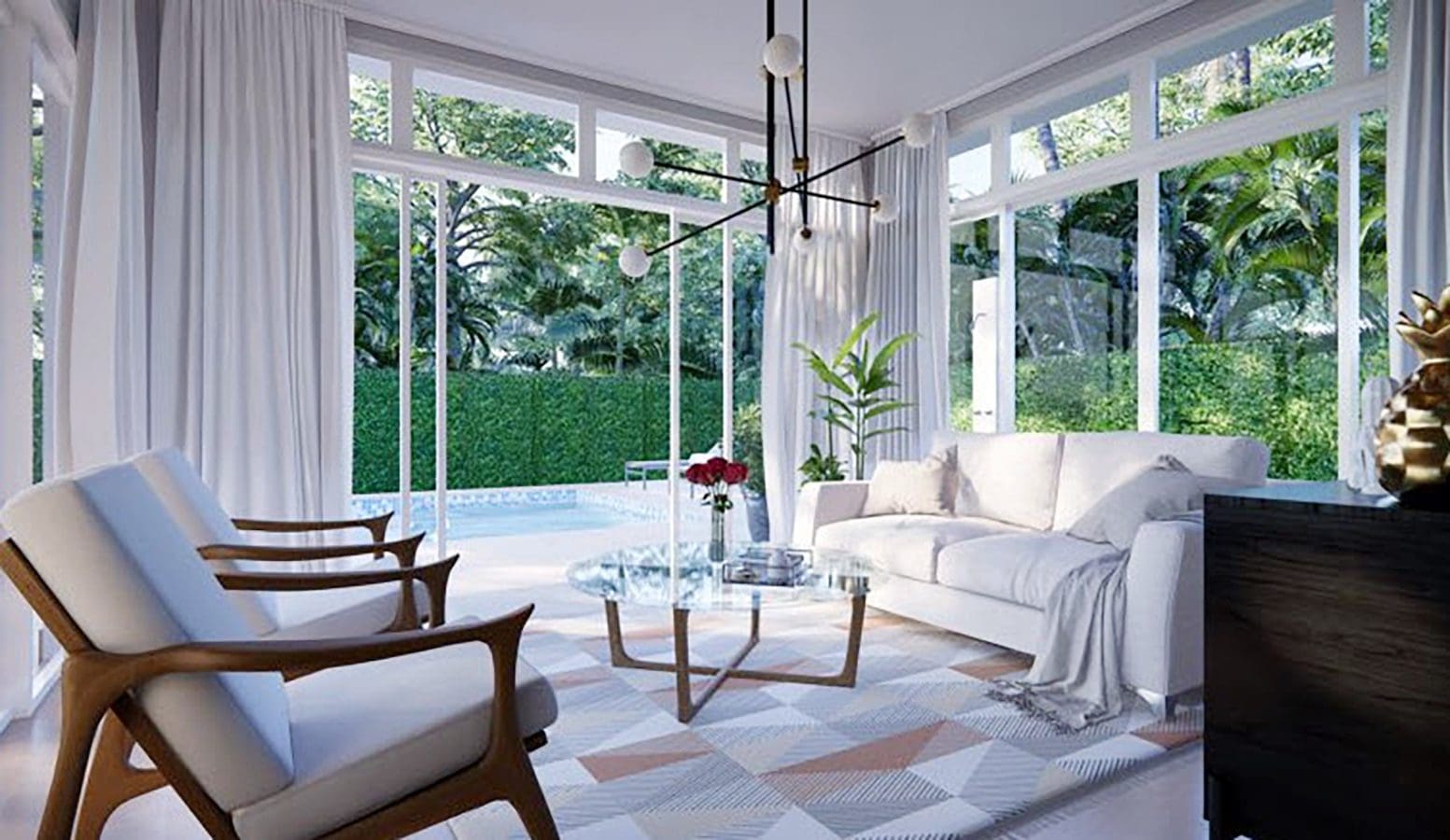 buyDRproperty Modern living room with large windows overlooking a lush garden. Beautiful Villa SUNSET Sosua Real Estate