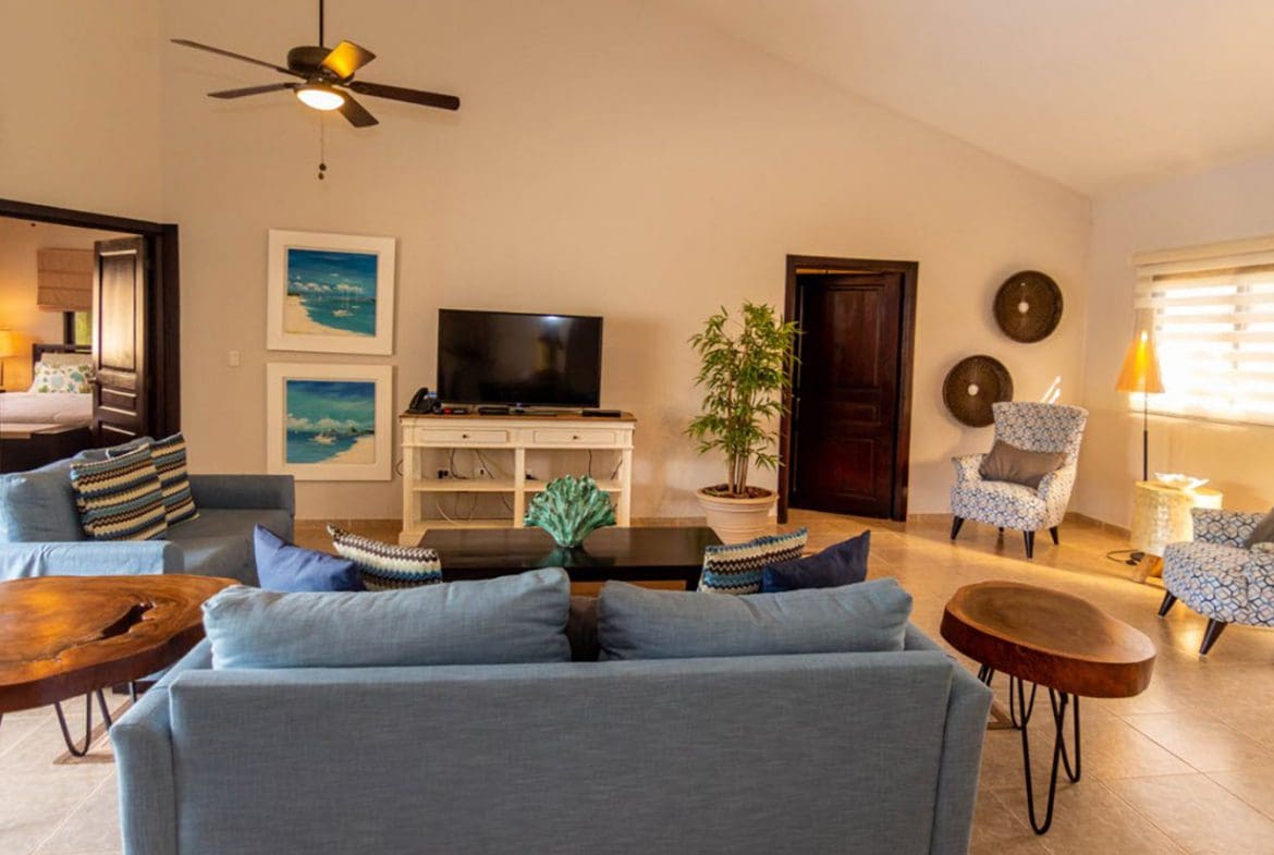buyDRproperty Beautiful Villa BELLA living room in Casa Linda with blue sofa and armchairs. Sosua Real Estate