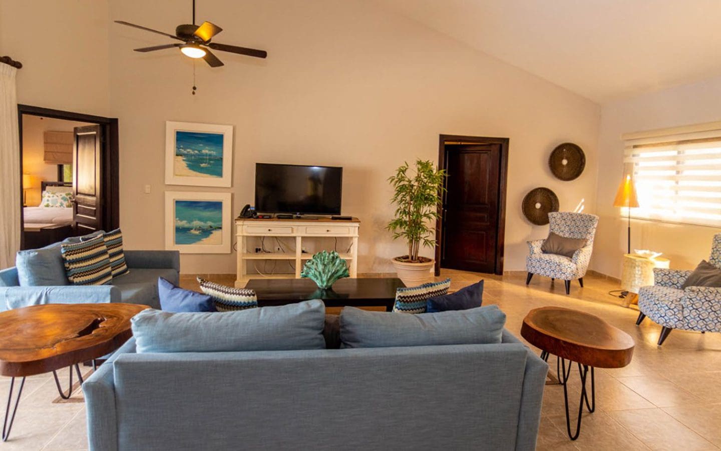 buyDRproperty Beautiful Villa BELLA living room in Casa Linda with blue sofa and armchairs. Sosua Real Estate