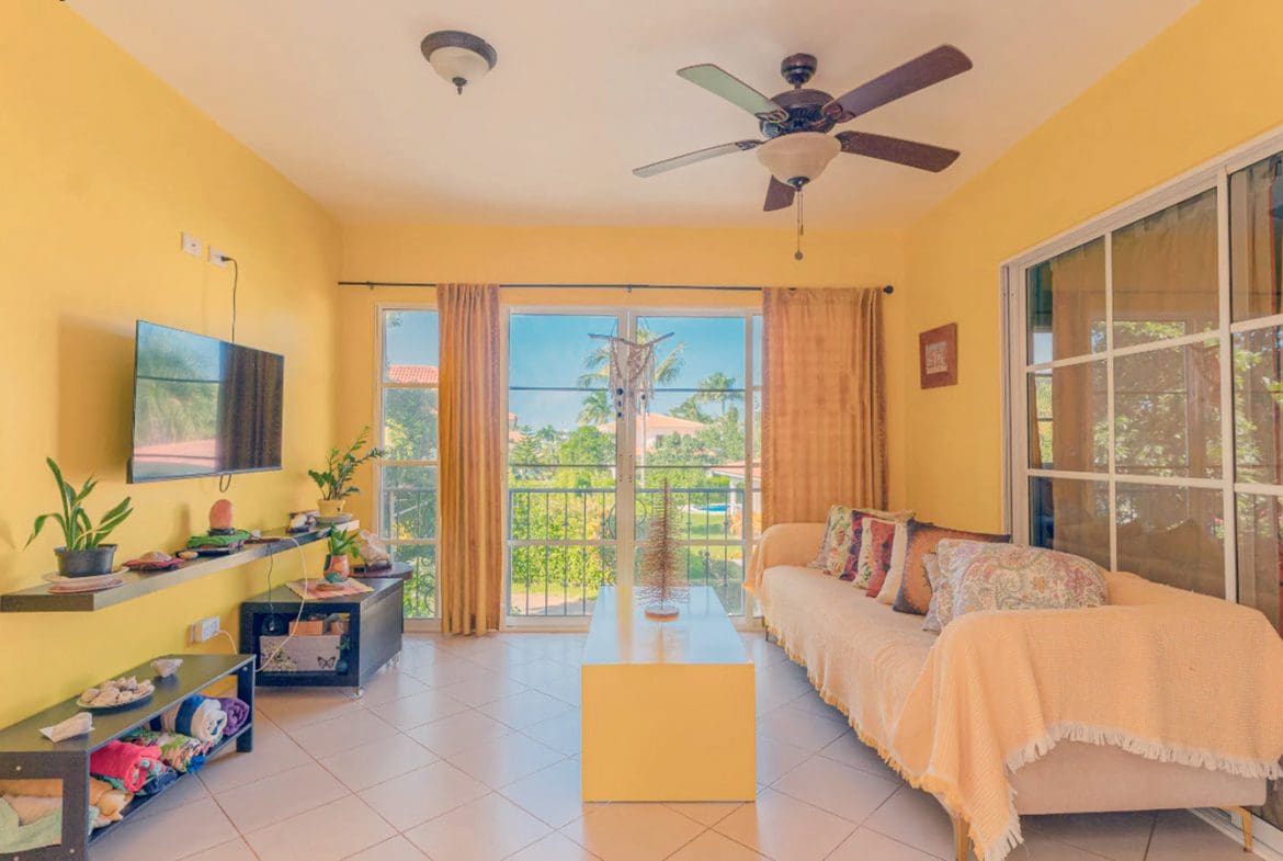 buyDRproperty Living room in a Hispaniola Two Unit Villa with yellow walls and a view. Residential Hispaniola. Sosua Real Estate