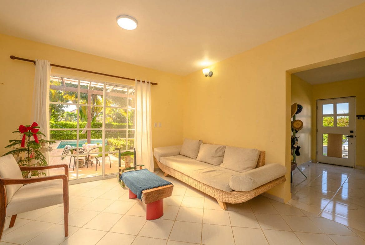 buyDRproperty Living room in a Residential Hispaniola villa with a view of the pool. Sosua Real Estate