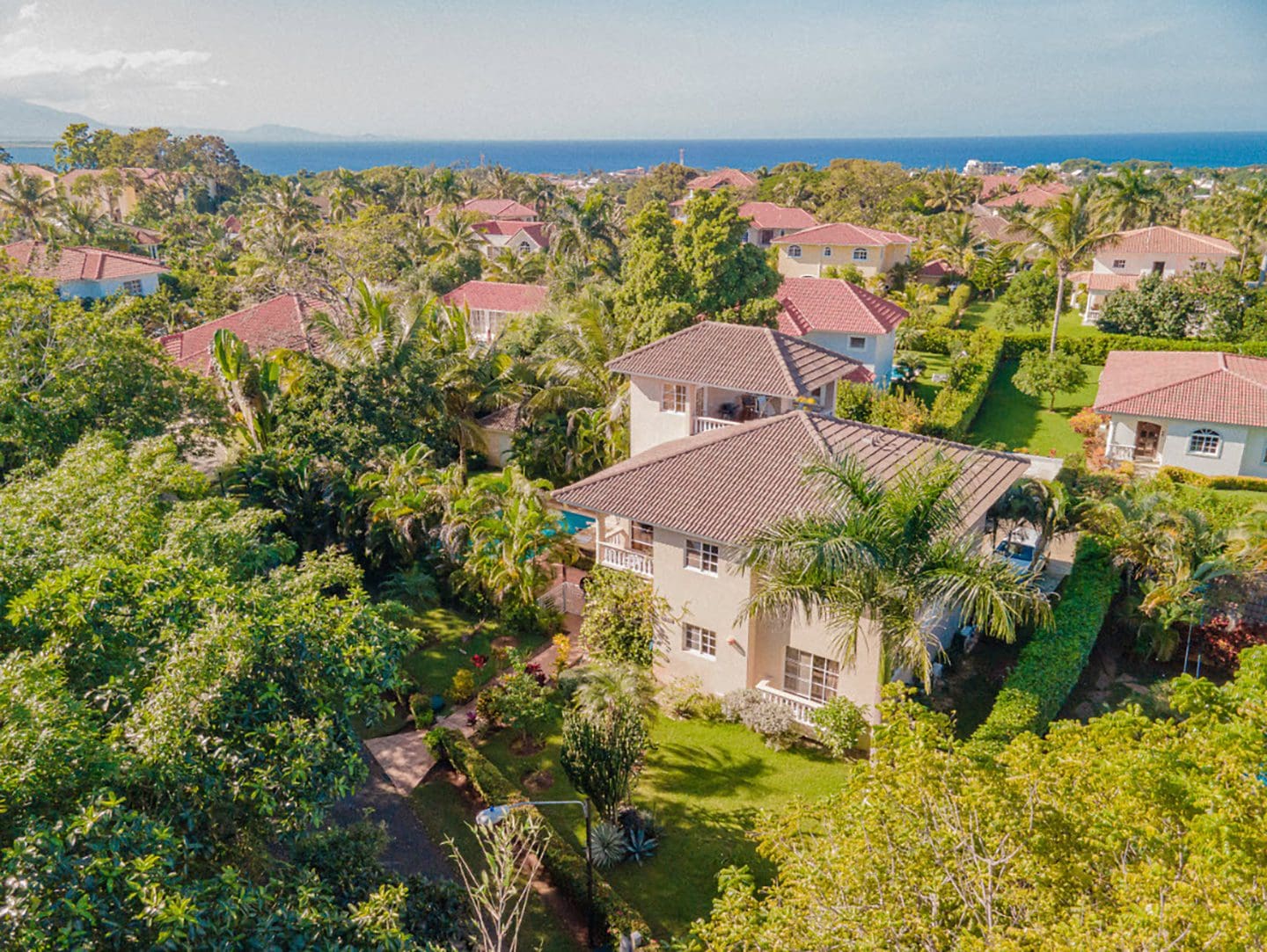 buyDRproperty Aerial view of a residential Hispaniola Two Unit Villa near the beach. Sosua Real Estate