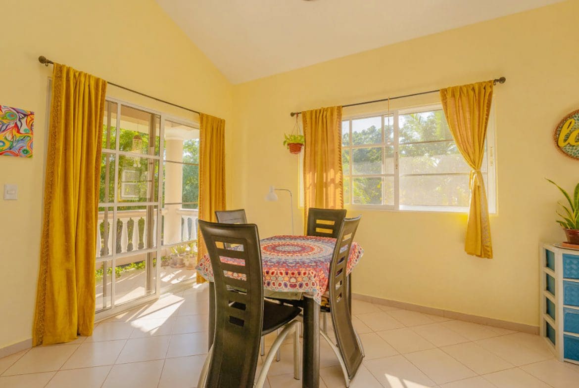 buyDRproperty Dining area in a Residential Hispaniola villa with a table and chairs. Sosua Real Estate