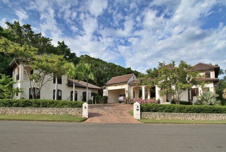 buyDRproperty Luxury Villa CAROLINA exterior with red brick driveway Sosua Real Estate