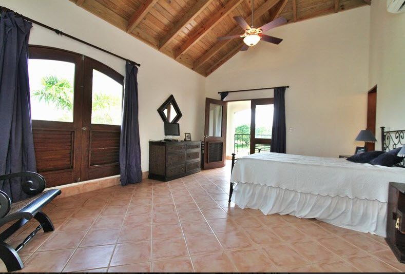 buyDRproperty Luxury bedroom in Villa CAROLINA with a high wooden ceiling Sosua Real Estate