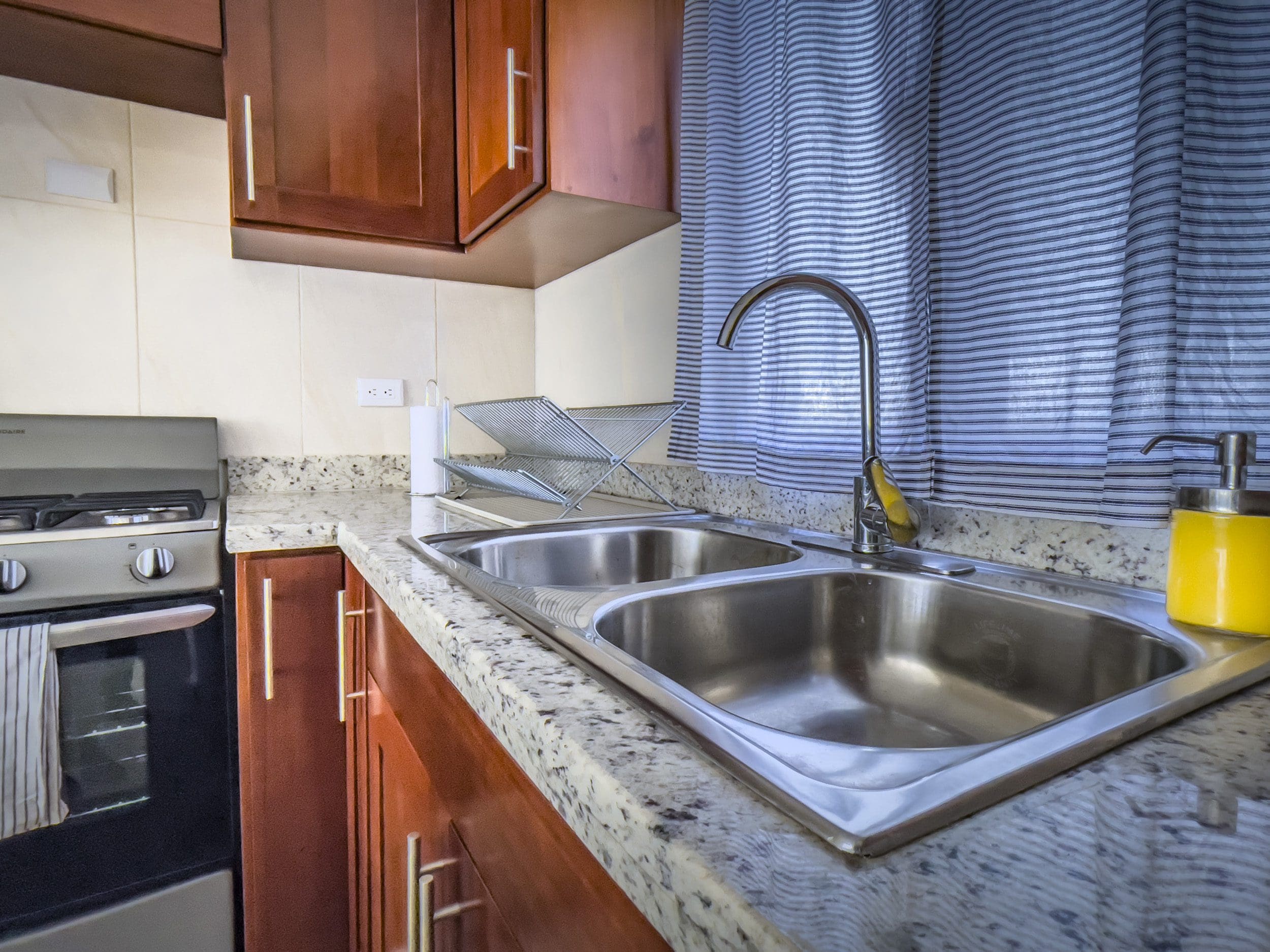 buyDRproperty Kitchen sink in a 2 bedroom villa for sale. Stainless steel sink with granite countertops. Sosua Real Estate