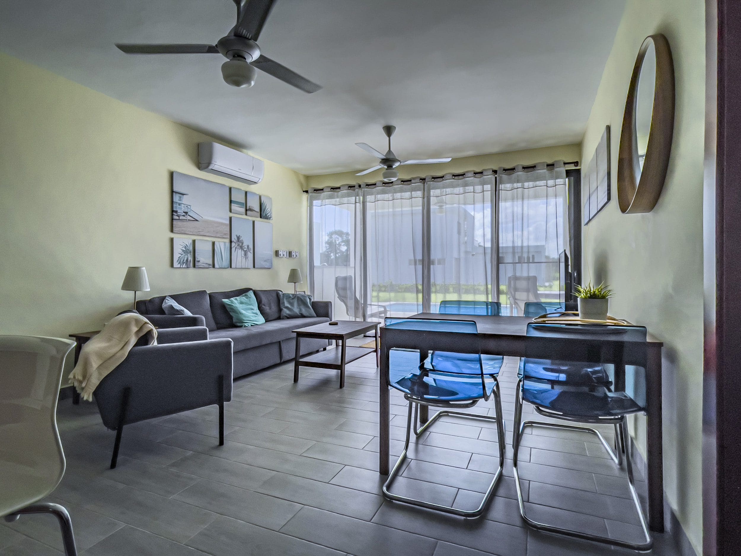 buyDRproperty Modern living room in a 2 bedroom villa for sale with dining table and chairs. Sosua Real Estate