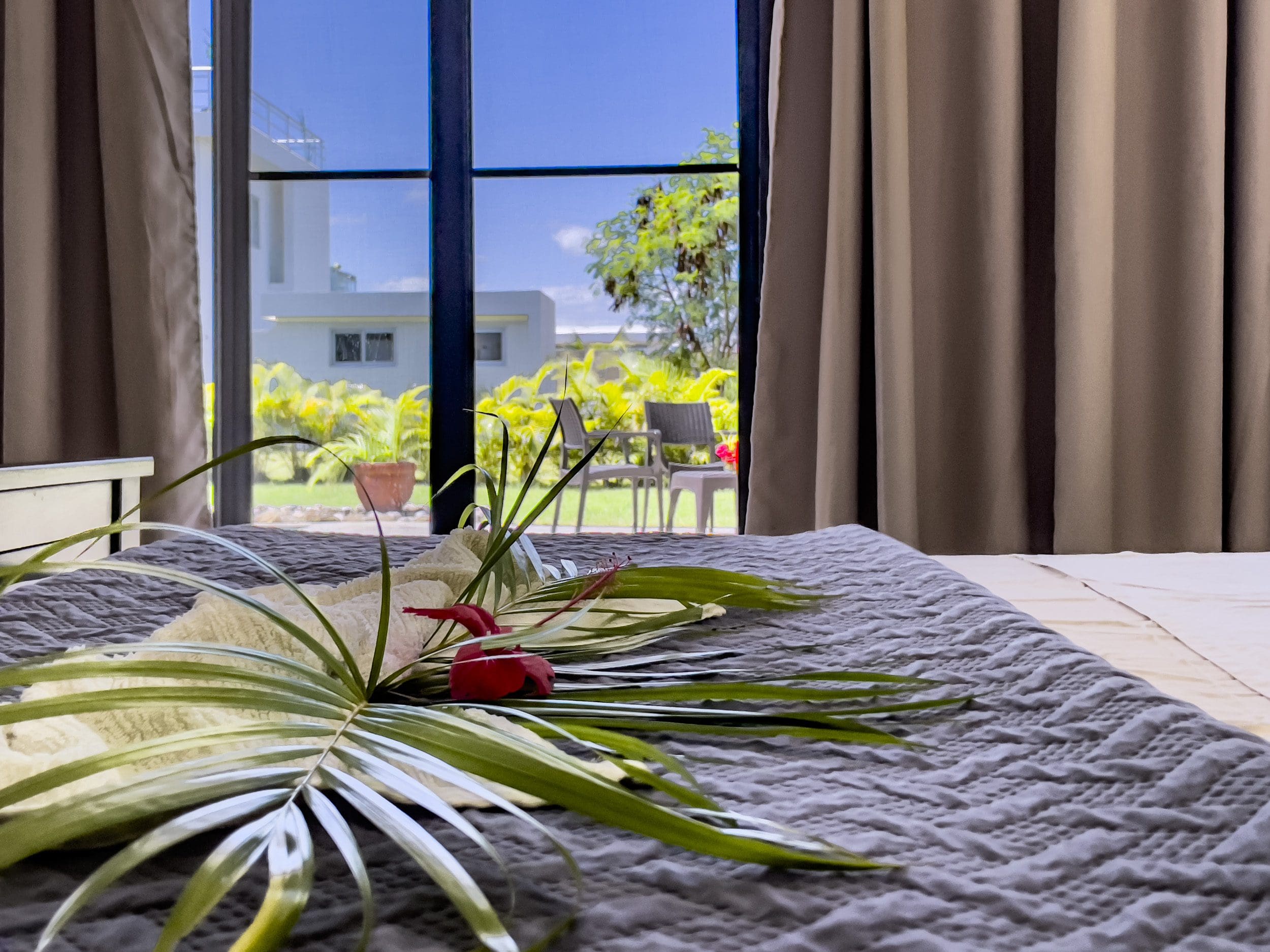 buyDRproperty Bedroom view of a 2 bedroom villa for sale, with tropical decor and outdoor view Sosua Real Estate