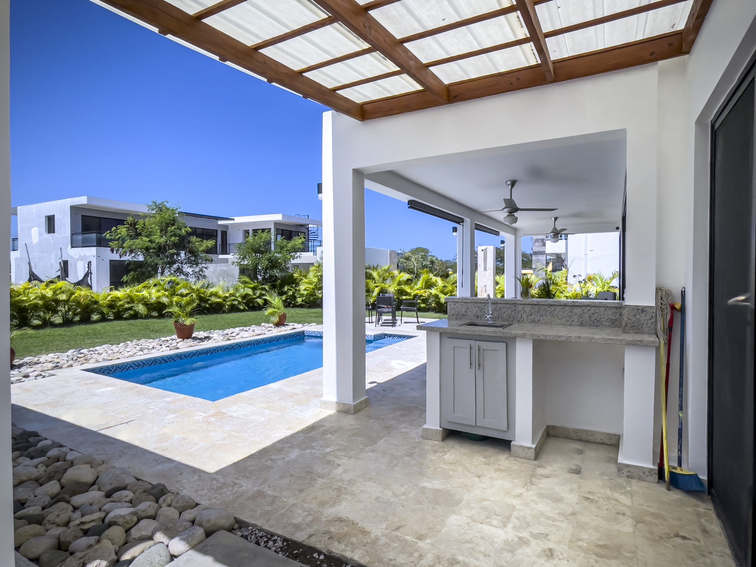 buyDRproperty Outdoor kitchen and pool at a 2 Bedroom Villa For Sale in SOV Sosua Real Estate