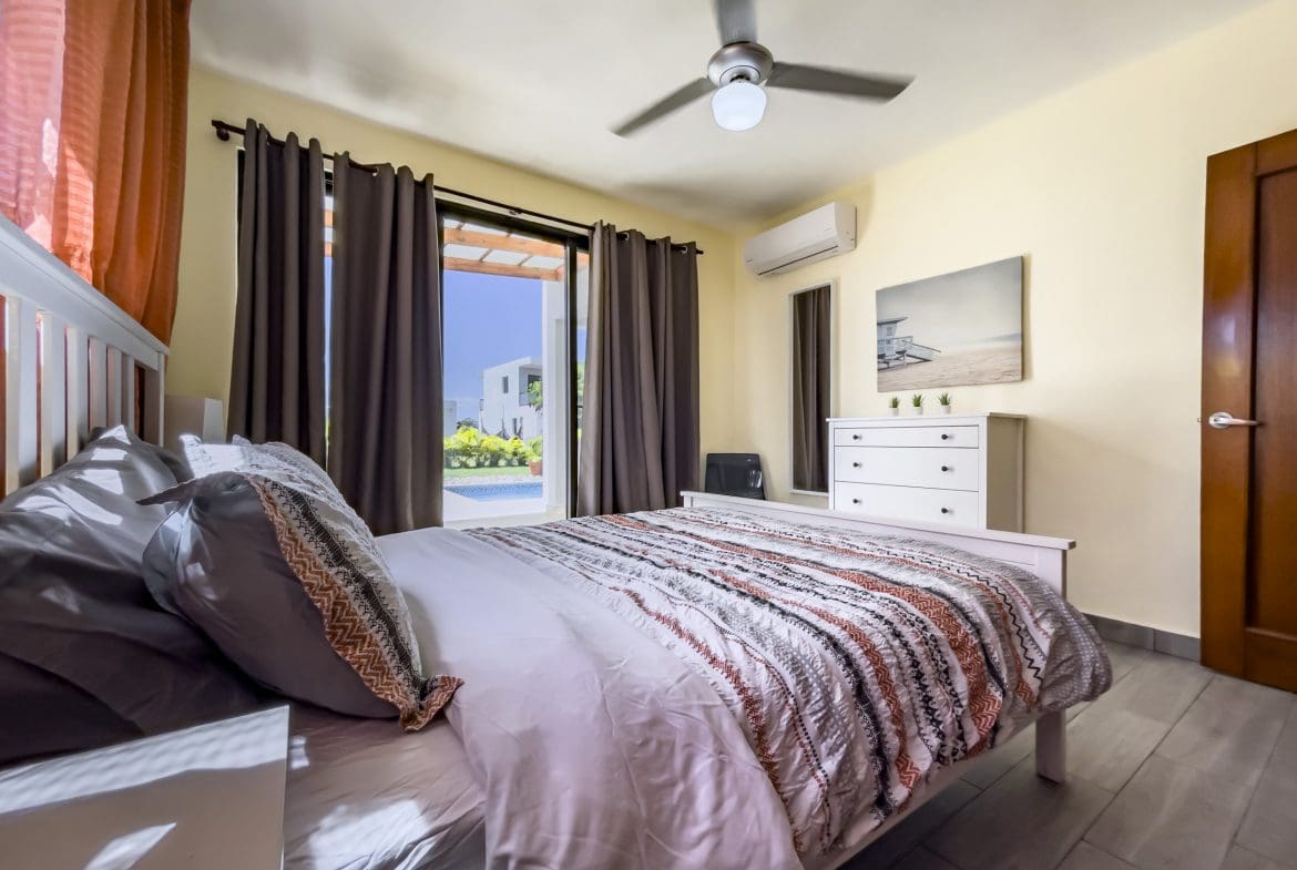 buyDRproperty Bedroom in a 2-bedroom villa for sale with a view of the pool Sosua Real Estate