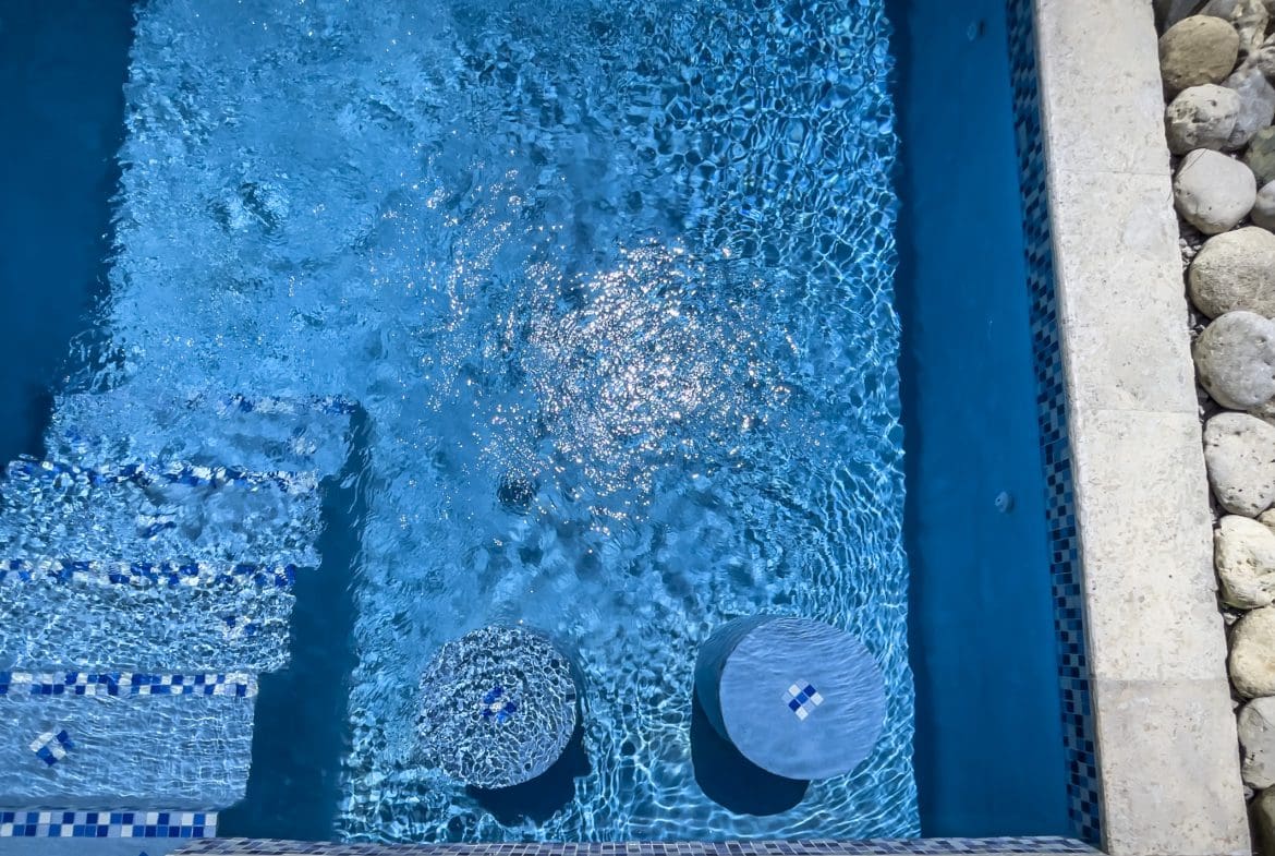 buyDRproperty Blue pool with steps and stools, perfect for a 2 Bedroom Villa For Sale. Sosua Real Estate