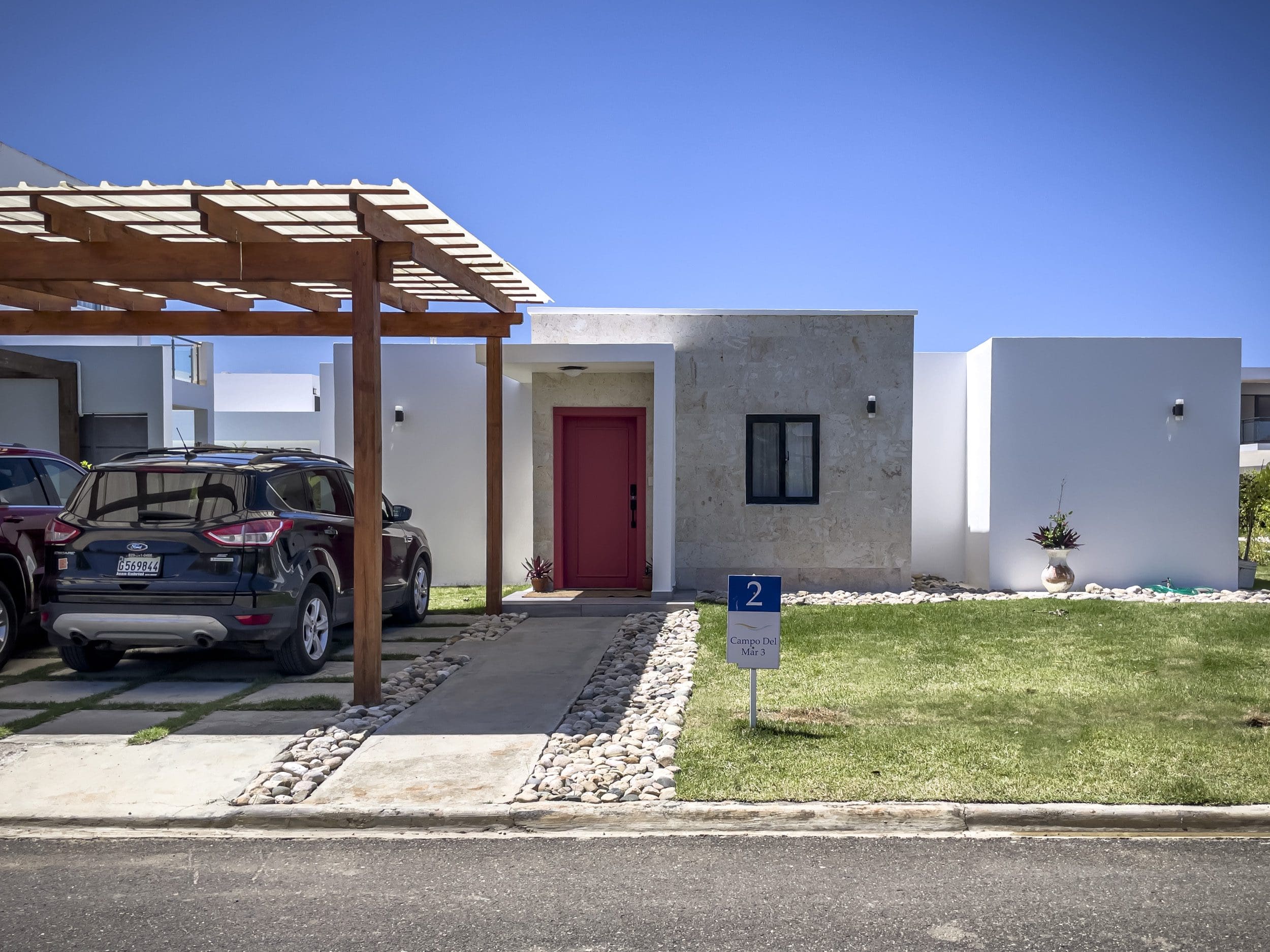 buyDRproperty Modern 2 bedroom villa for sale with red door and carport, Campo Del Mar 3 Sosua Real Estate