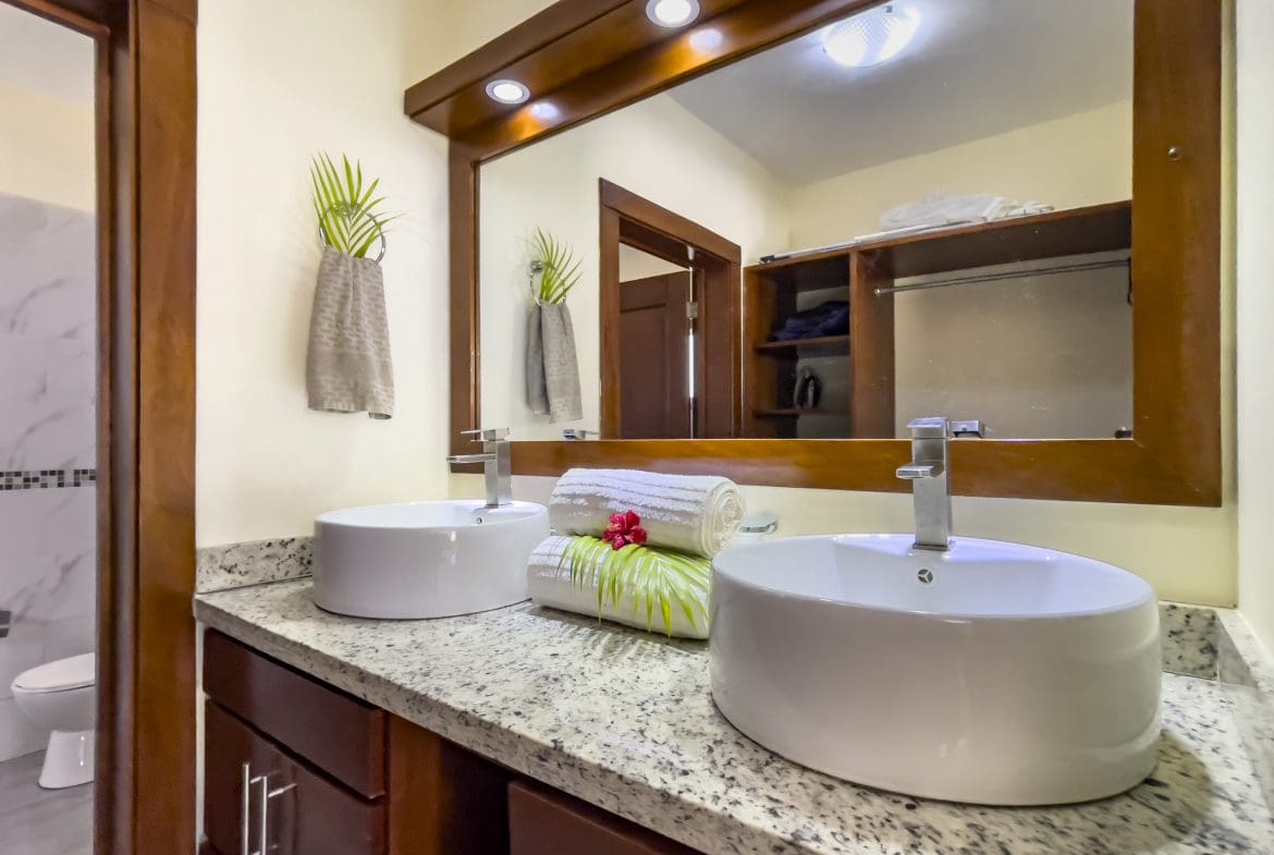 buyDRproperty Modern bathroom with dual vessel sinks, part of a 2 Bedroom Villa For Sale. Sosua Real Estate