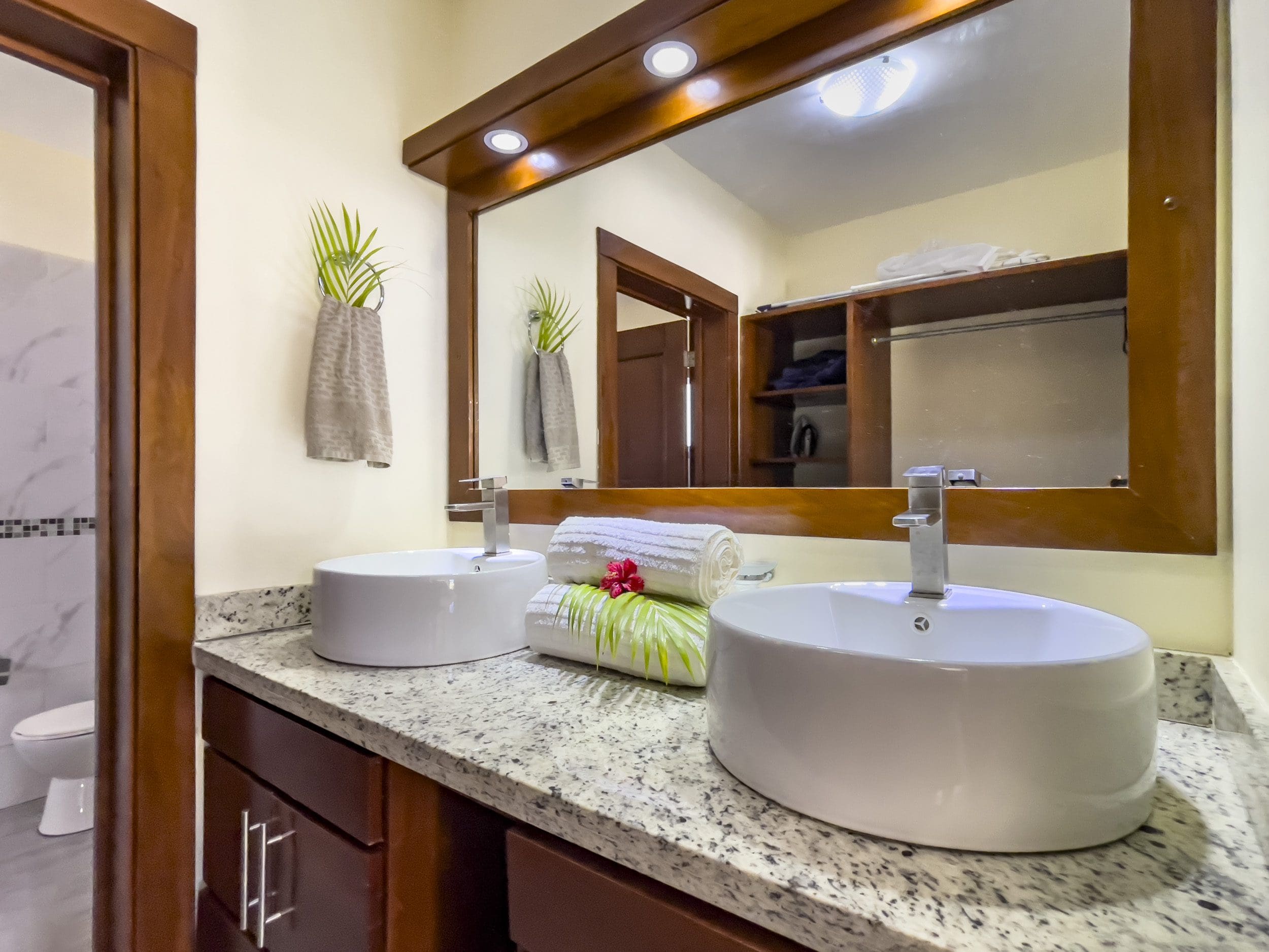 buyDRproperty Modern bathroom with dual vessel sinks, part of a 2 Bedroom Villa For Sale. Sosua Real Estate