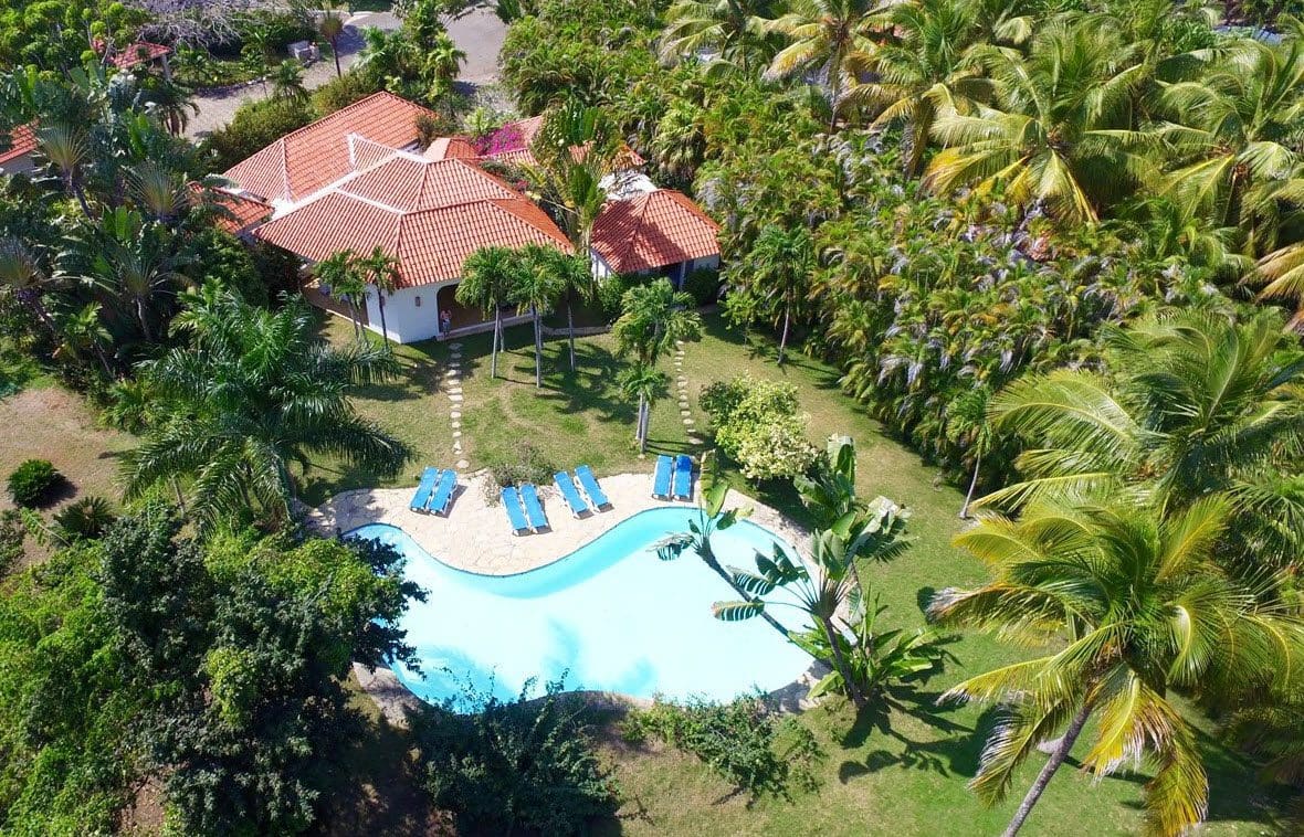 buyDRproperty Aerial view of Villa Blanca estate in Sea Horse Ranch with pool and tropical landscaping. Sosua Real Estate