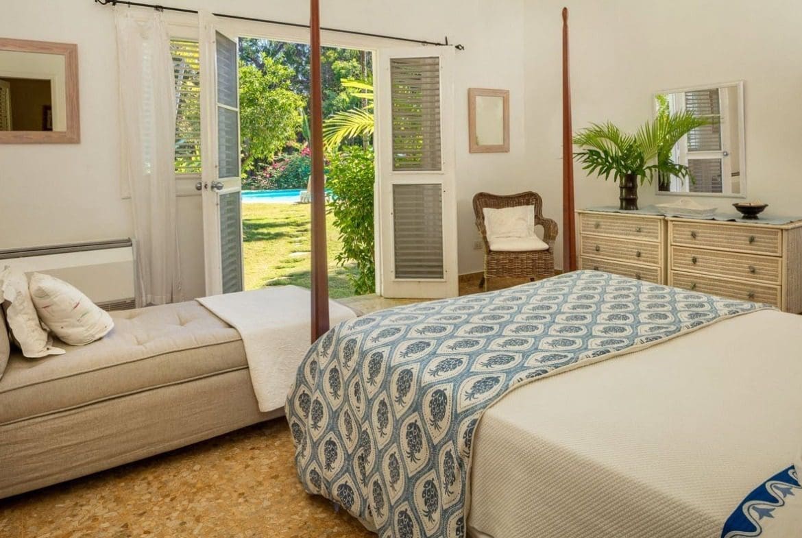 buyDRproperty Bedroom at Villa Blanca in Sea Horse Ranch with bed and garden view. Sosua Real Estate