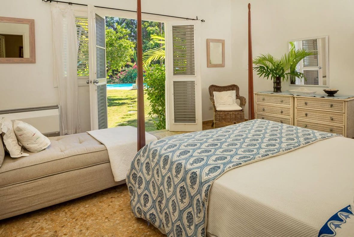 buyDRproperty Bedroom at Villa Blanca in Sea Horse Ranch with bed and garden view. Sosua Real Estate