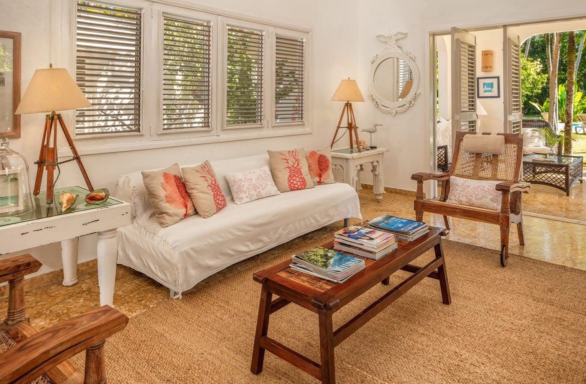 buyDRproperty Living room in Villa Blanca, Sea Horse Ranch estate, with sofa and garden access Sosua Real Estate