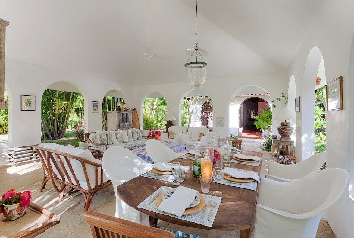 buyDRproperty Sea Horse Ranch Villa dining room with wooden table and white chairs. Sosua Real Estate
