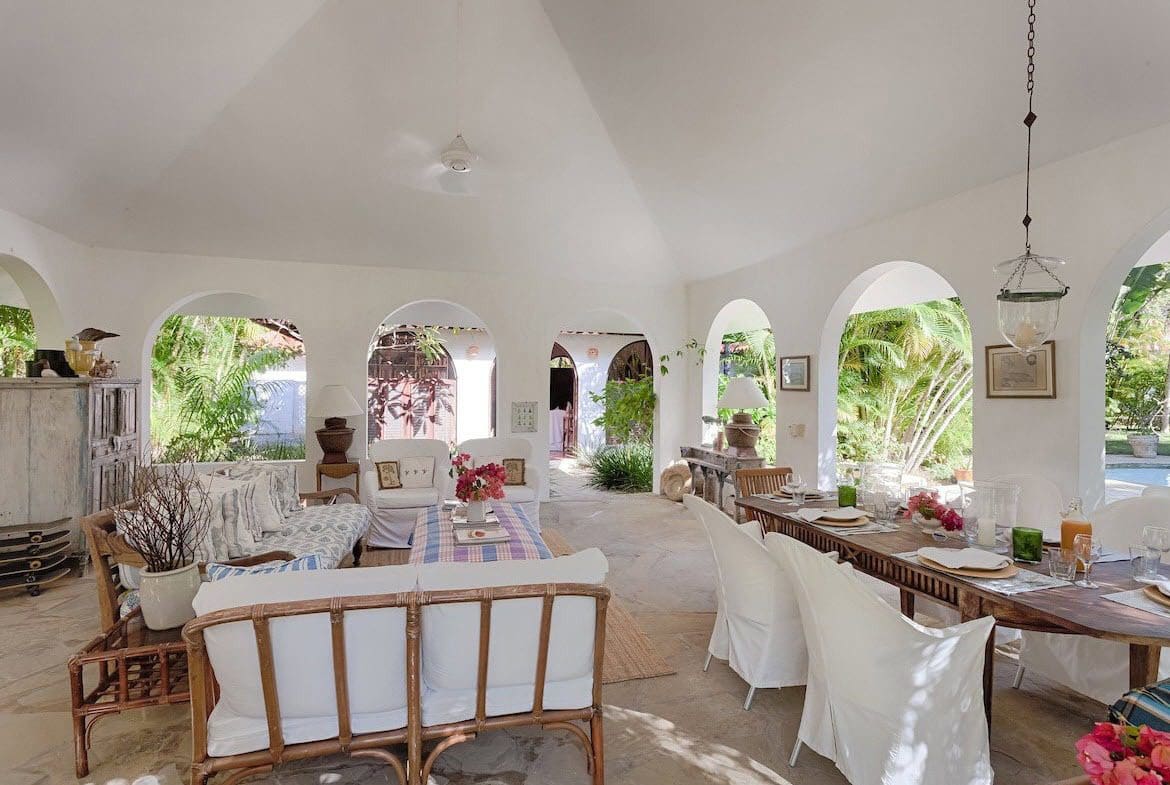 buyDRproperty Spacious Sea Horse Ranch Villa living room with arched doorways and outdoor views. Sosua Real Estate