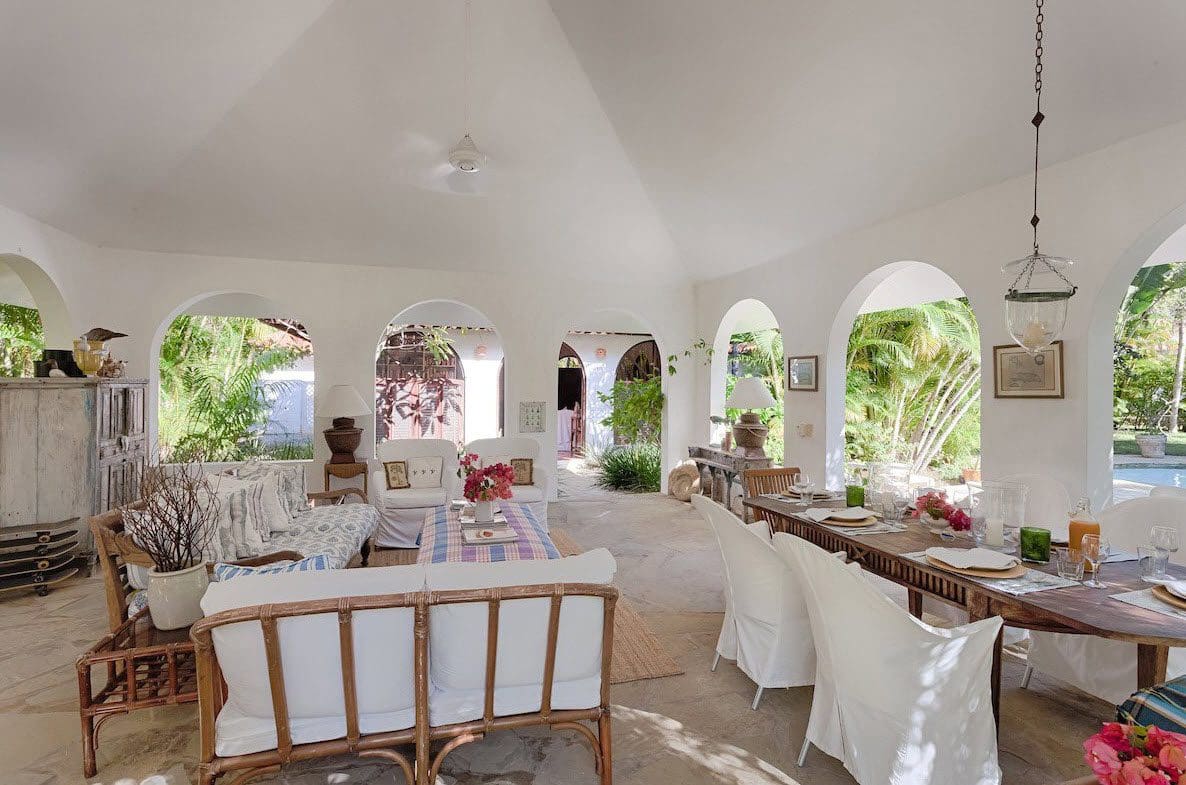 buyDRproperty Spacious Sea Horse Ranch Villa living room with arched doorways and outdoor views. Sosua Real Estate