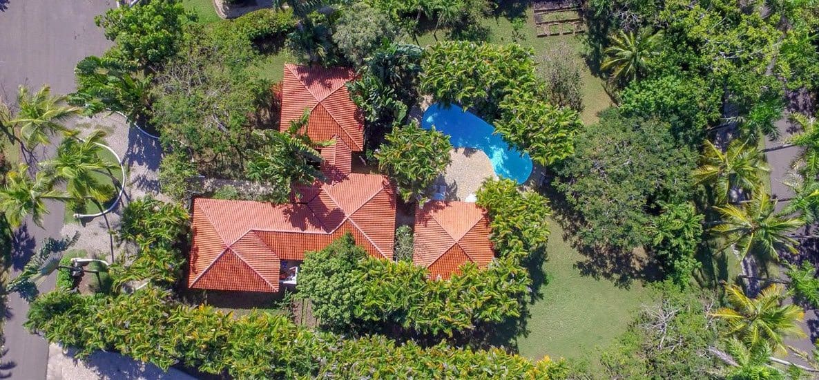 buyDRproperty Aerial view of Sea Horse Ranch Villa with pool and tropical landscaping Sosua Real Estate