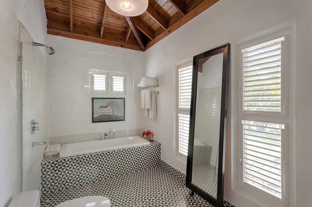 buyDRproperty Luxury bathroom with black and white geometric tile, part of a Sea Horse Ranch Villa. Sosua Real Estate