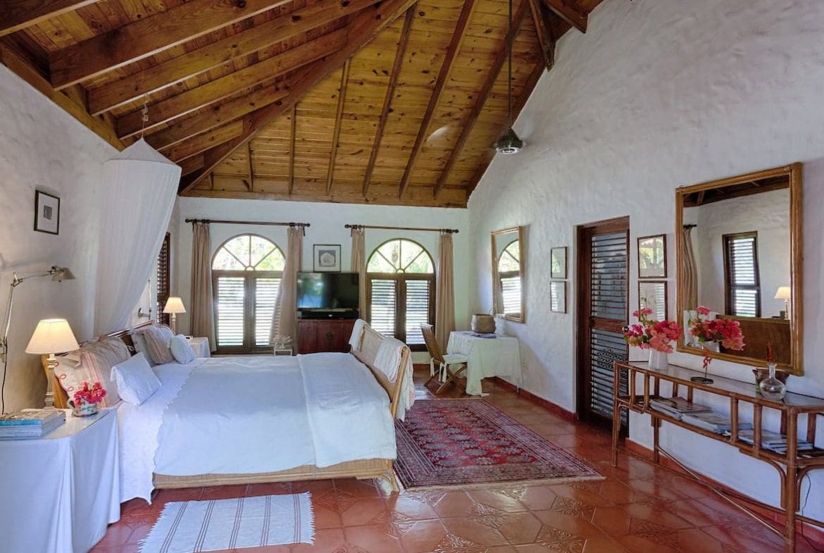 buyDRproperty Bedroom in Sea Horse Ranch Villa with wooden ceiling and white walls Sosua Real Estate