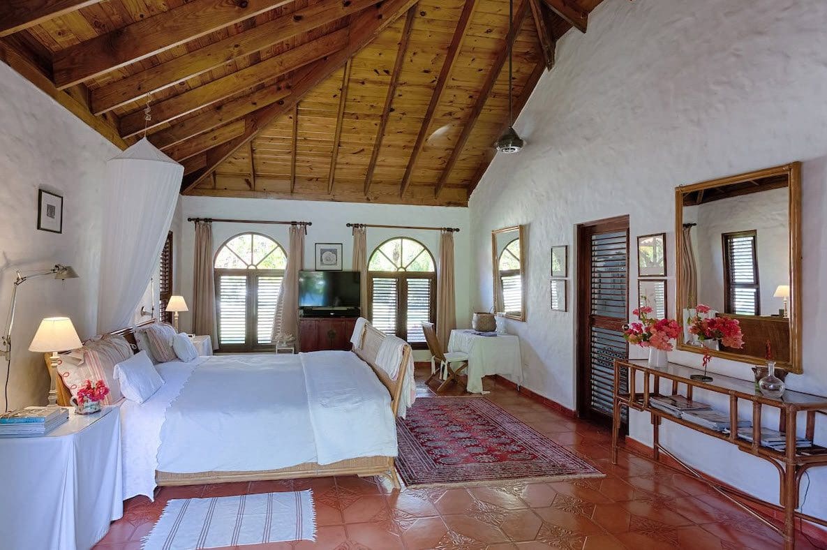 buyDRproperty Bedroom in Sea Horse Ranch Villa with wooden ceiling and white walls Sosua Real Estate