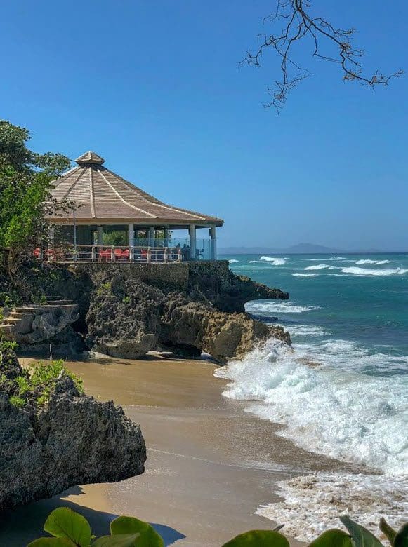 buyDRproperty Sea Horse Ranch Villa view of gazebo on rocky coast with ocean waves Sosua Real Estate