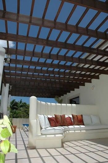 buyDRproperty Beautiful VILLA BRILLANTE patio with wooden pergola and comfortable seating Sosua Real Estate