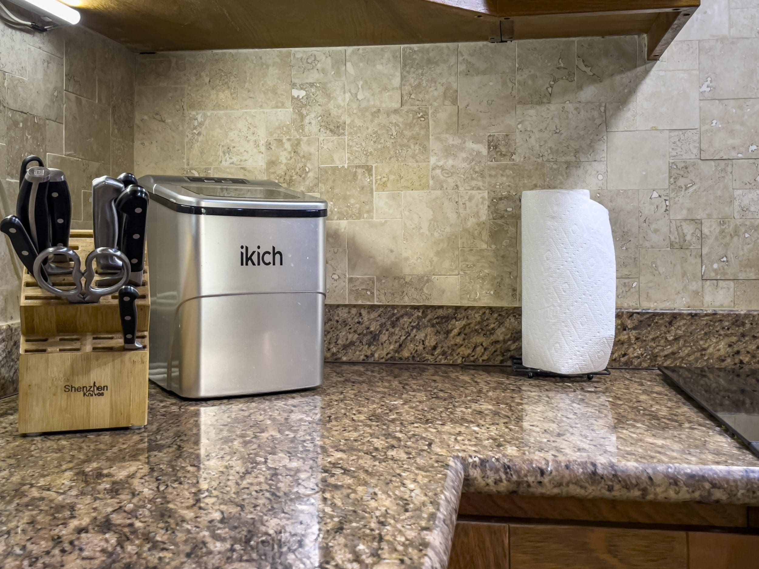buyDRproperty Kitchen countertop with an ice maker, knife block, and paper towel holder. Sosua Real Estate