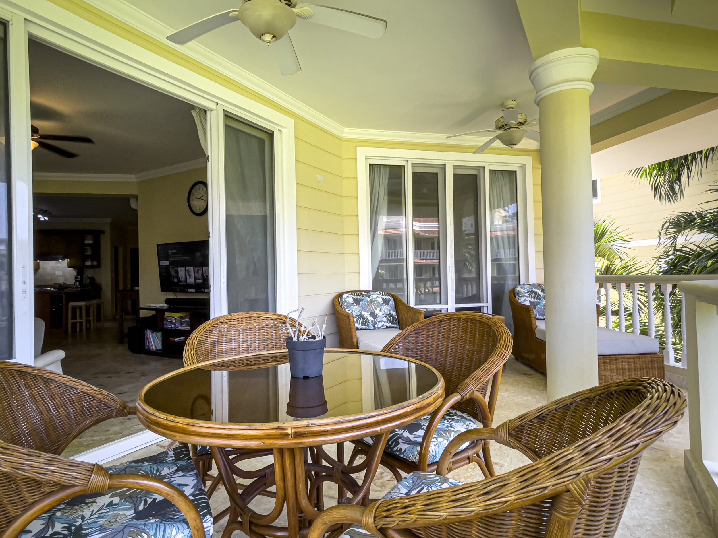 buyDRproperty Wicker patio furniture on a Sosua condo balcony with ocean views Sosua Real Estate