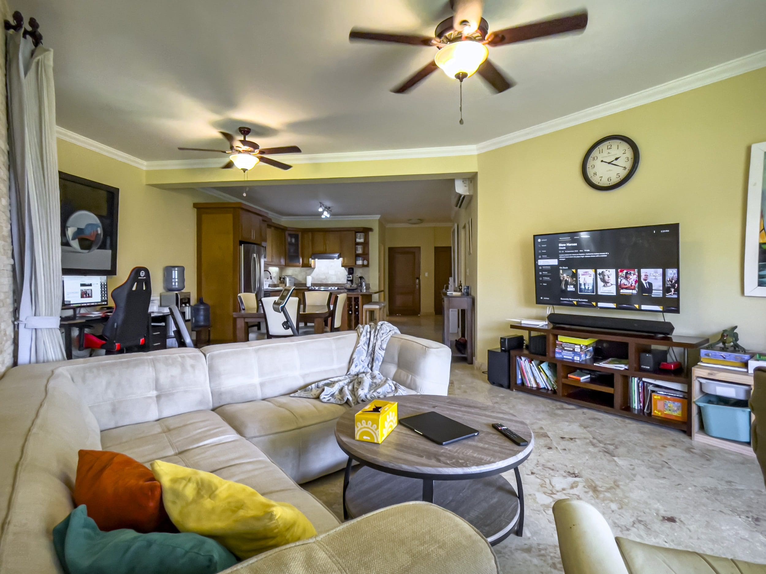 buyDRproperty Living room in a Sosua condo with a comfortable sofa and TV. Sosua Real Estate