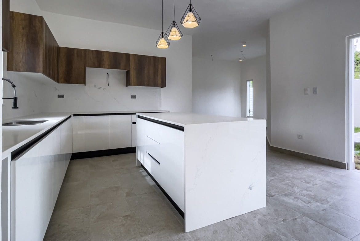 buyDRproperty Modern kitchen with white cabinets in a villa for sale Sosua Real Estate