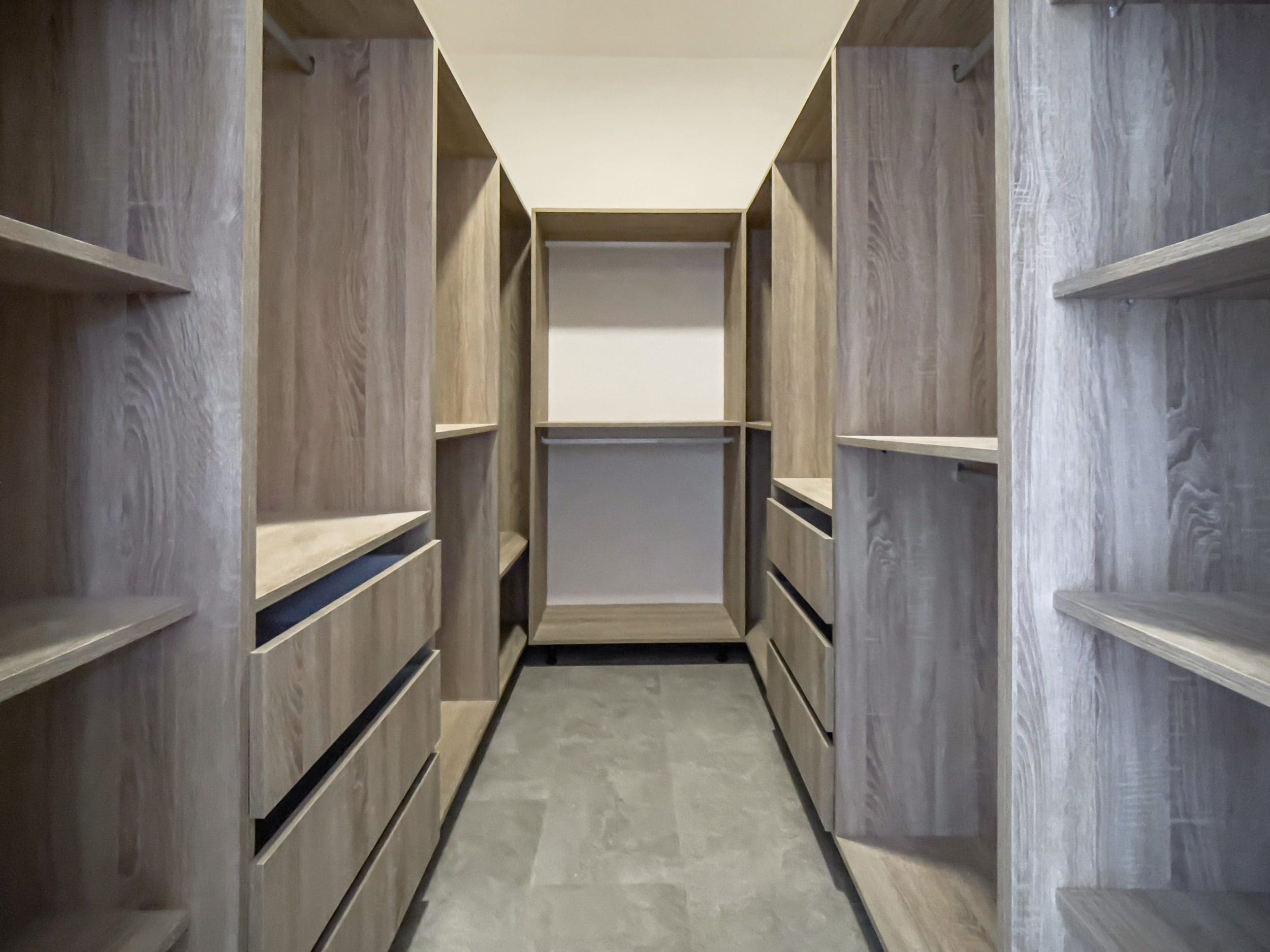 buyDRproperty Empty walk-in closet with wooden shelves and drawers. Villa for sale. Sosua Real Estate
