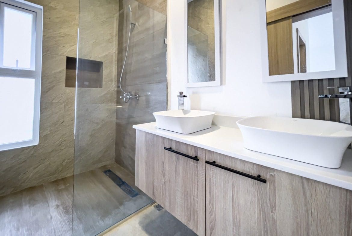 buyDRproperty Modern bathroom with double sinks in a villa for sale. Sosua Real Estate