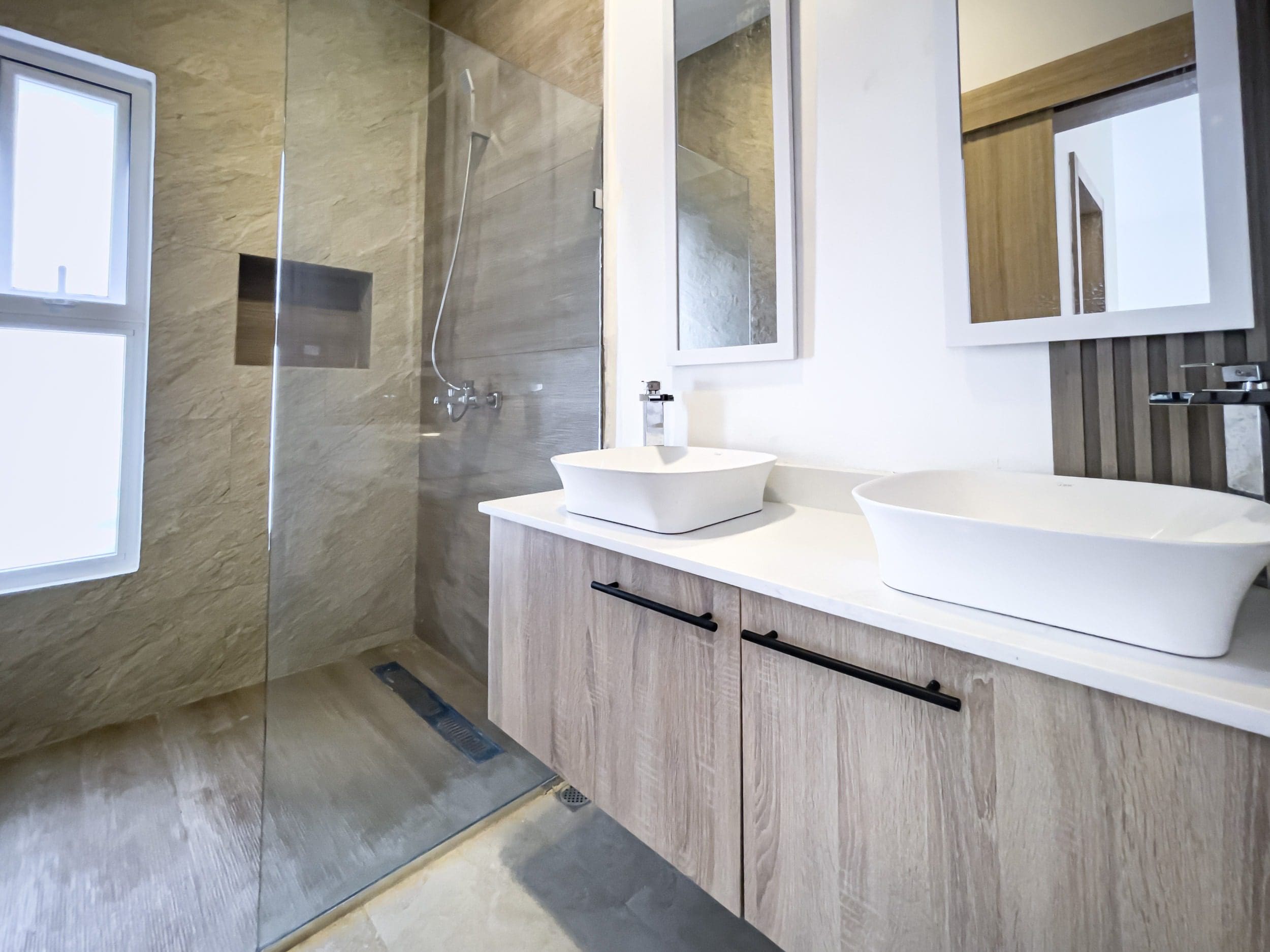 buyDRproperty Modern bathroom with double sinks in a villa for sale. Sosua Real Estate
