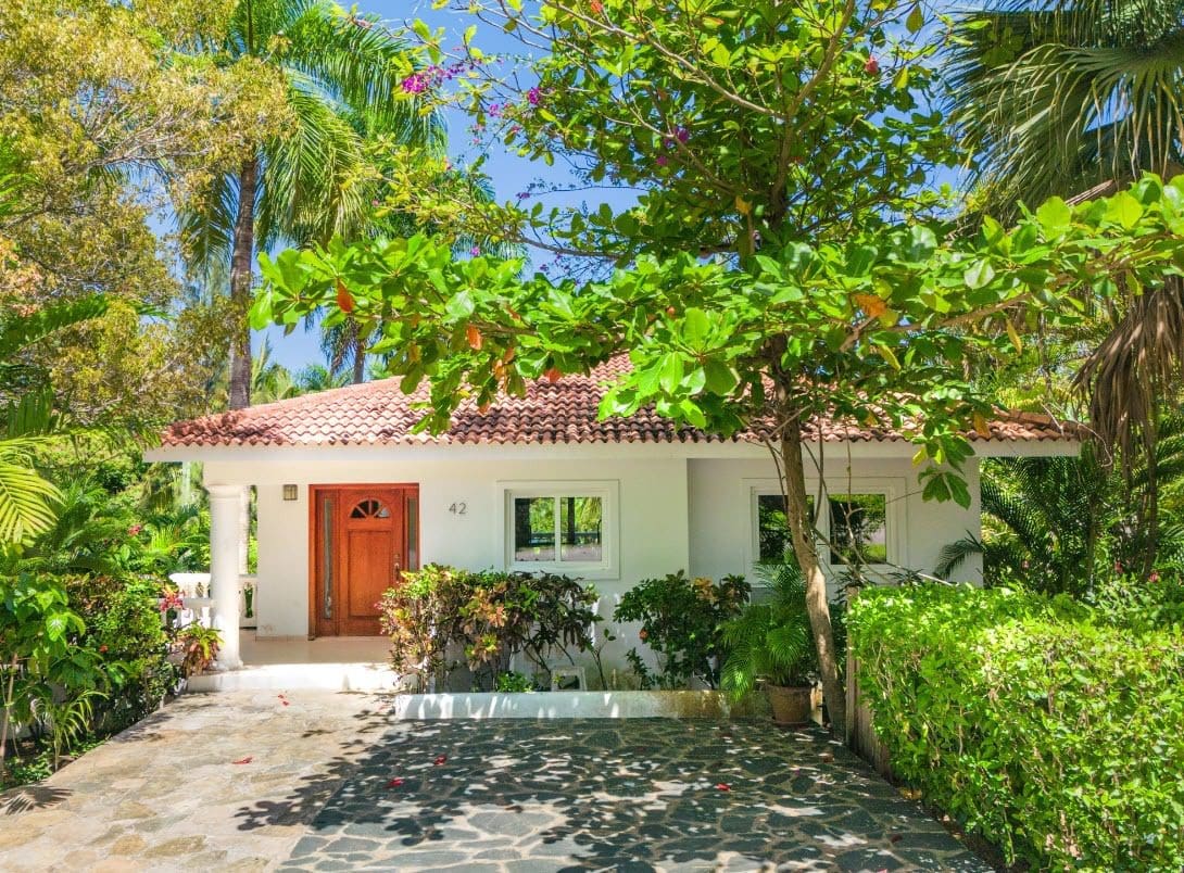 buyDRproperty Tropical villa exterior with lush landscaping, Sosua Hispaniola Residential Sosua Real Estate