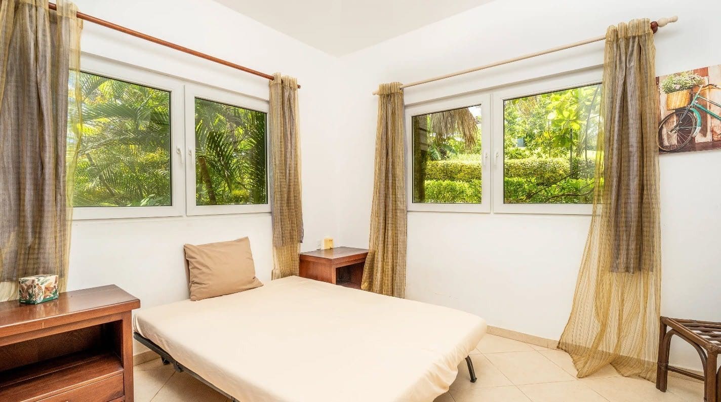 buyDRproperty Bedroom with tropical views, part of a villa for sale. Sosua Real Estate