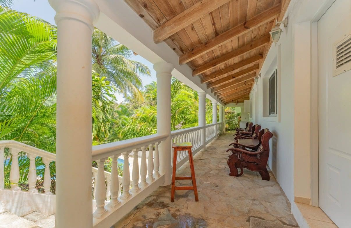 buyDRproperty Tropical villa balcony with lush green surroundings, Sosua, Hispaniola Residential. Sosua Real Estate