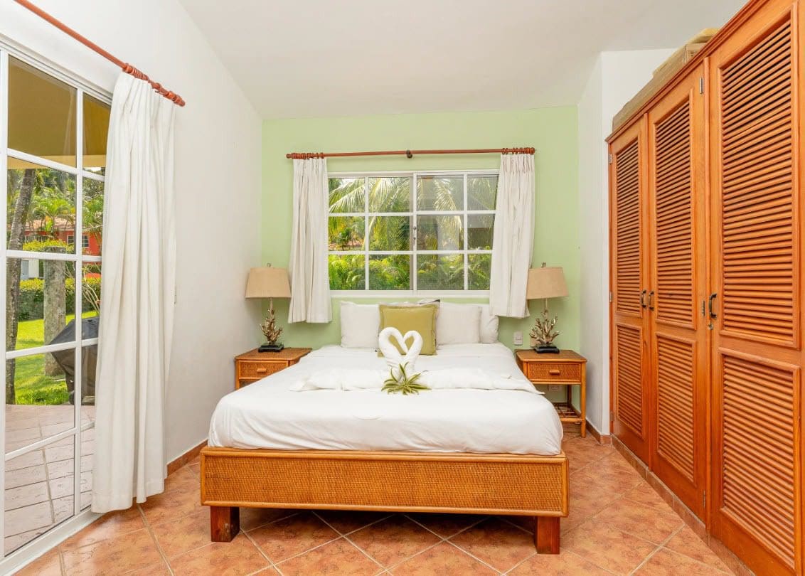 buyDRproperty Cozy bedroom in a Two Bedroom villa For Sale, with a queen bed and large wardrobe. Sosua Real Estate