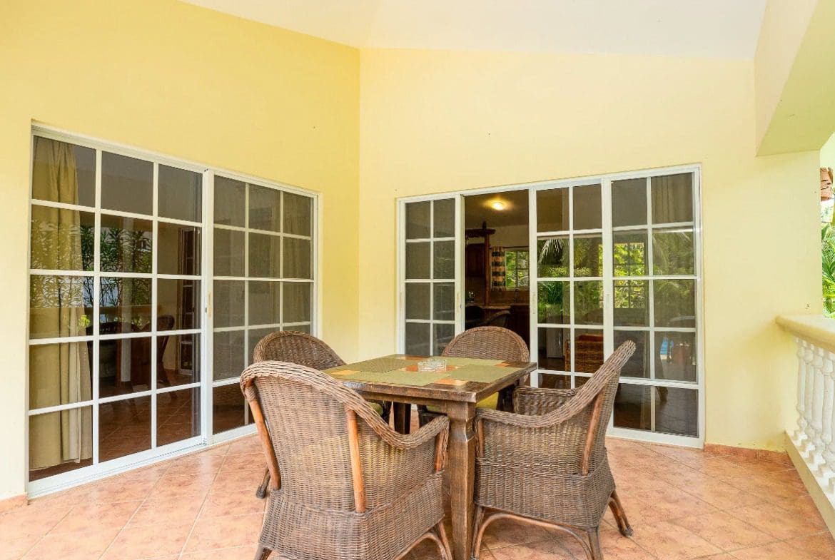 buyDRproperty Outdoor patio with wicker furniture at a villa Sosua Real Estate